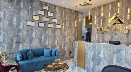 Stylish reception area at Jollie Atelier Beauty Center, Dubai, Dubai, AE with modern design and framed certificates.