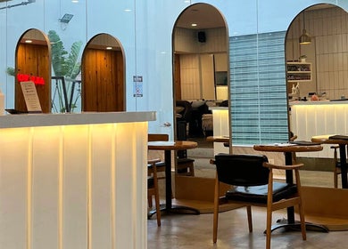 Elegant interior of Rinoa Japanese Hair Salon in Cebu City, Central Visayas, PH. Featuring stylish seating and warm lighting.