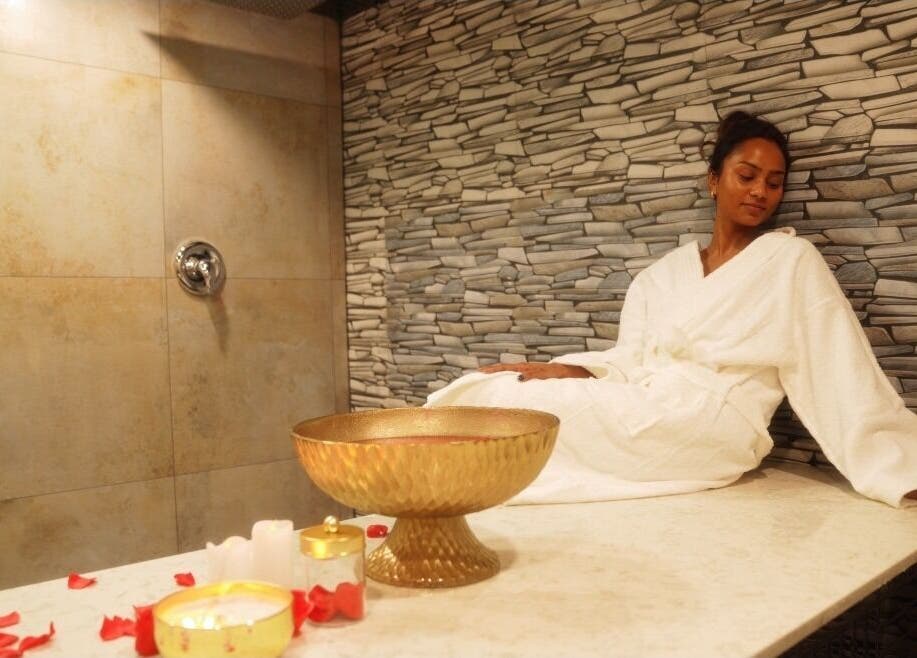 Relaxing spa room at Meye - Beautè Verte in Montréal, Québec, CA featuring a woman in a white robe.