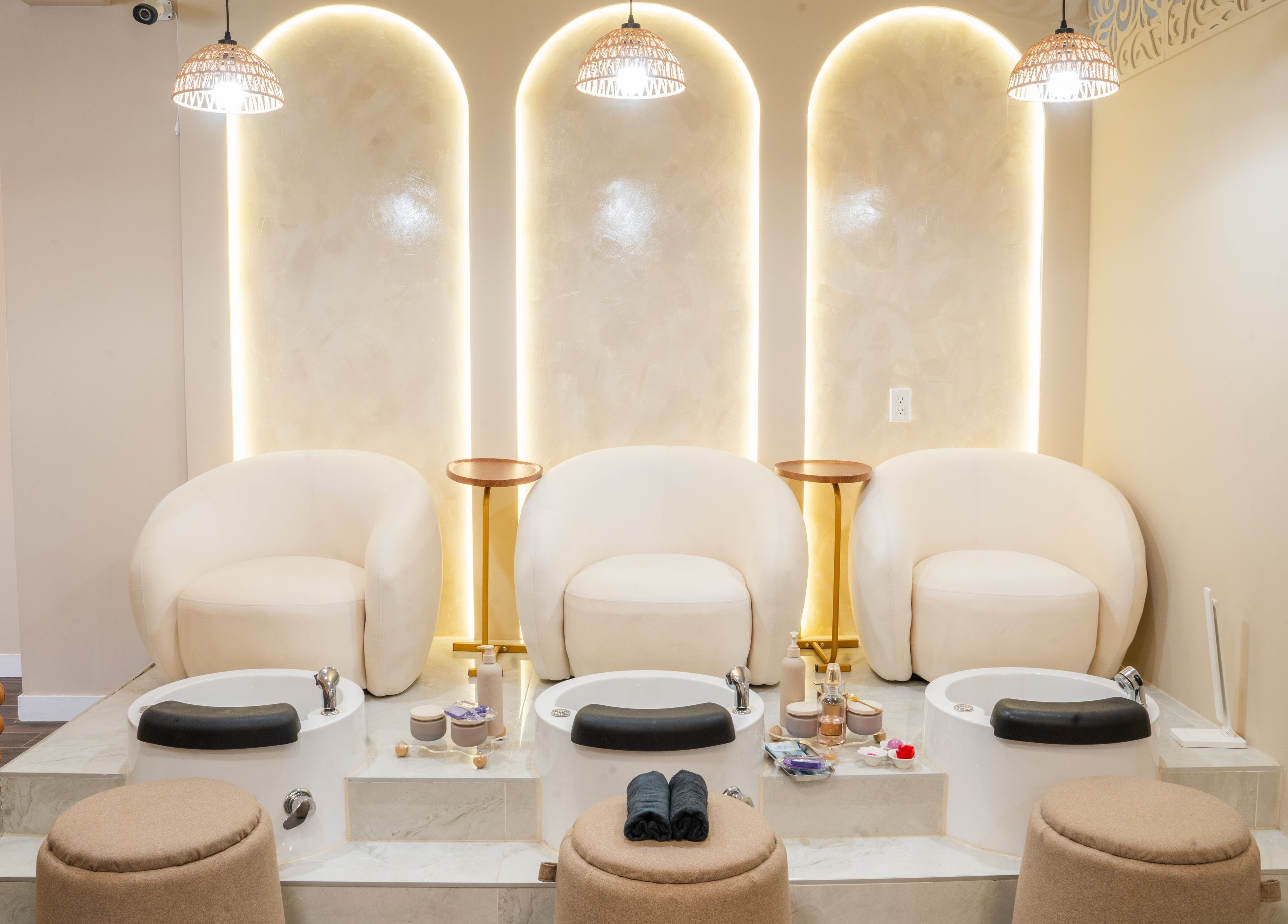 Luxurious pedicure area at Meye - Beautè Verte, Montréal, Québec, CA with plush chairs and ambient lighting.