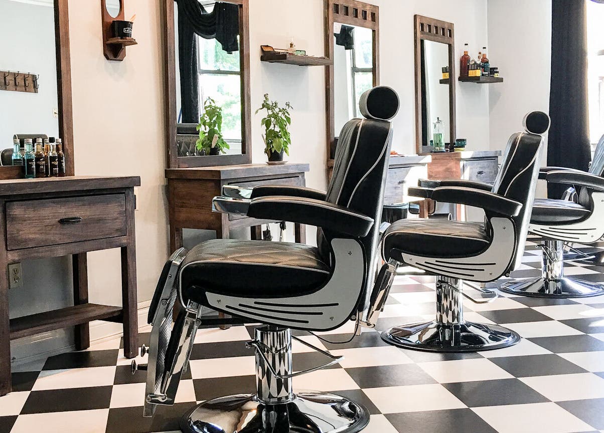 Elegant barber chairs in Maribella Salon LLC, Wilmington, Delaware, US, showcasing chic interior design.