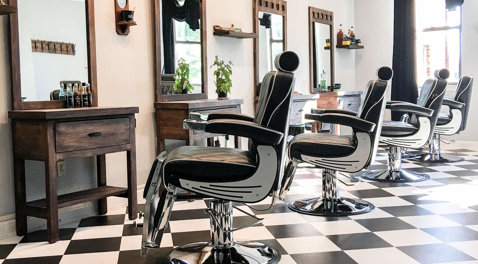 Elegant barber chairs in Maribella Salon LLC, Wilmington, Delaware, US, showcasing chic interior design.