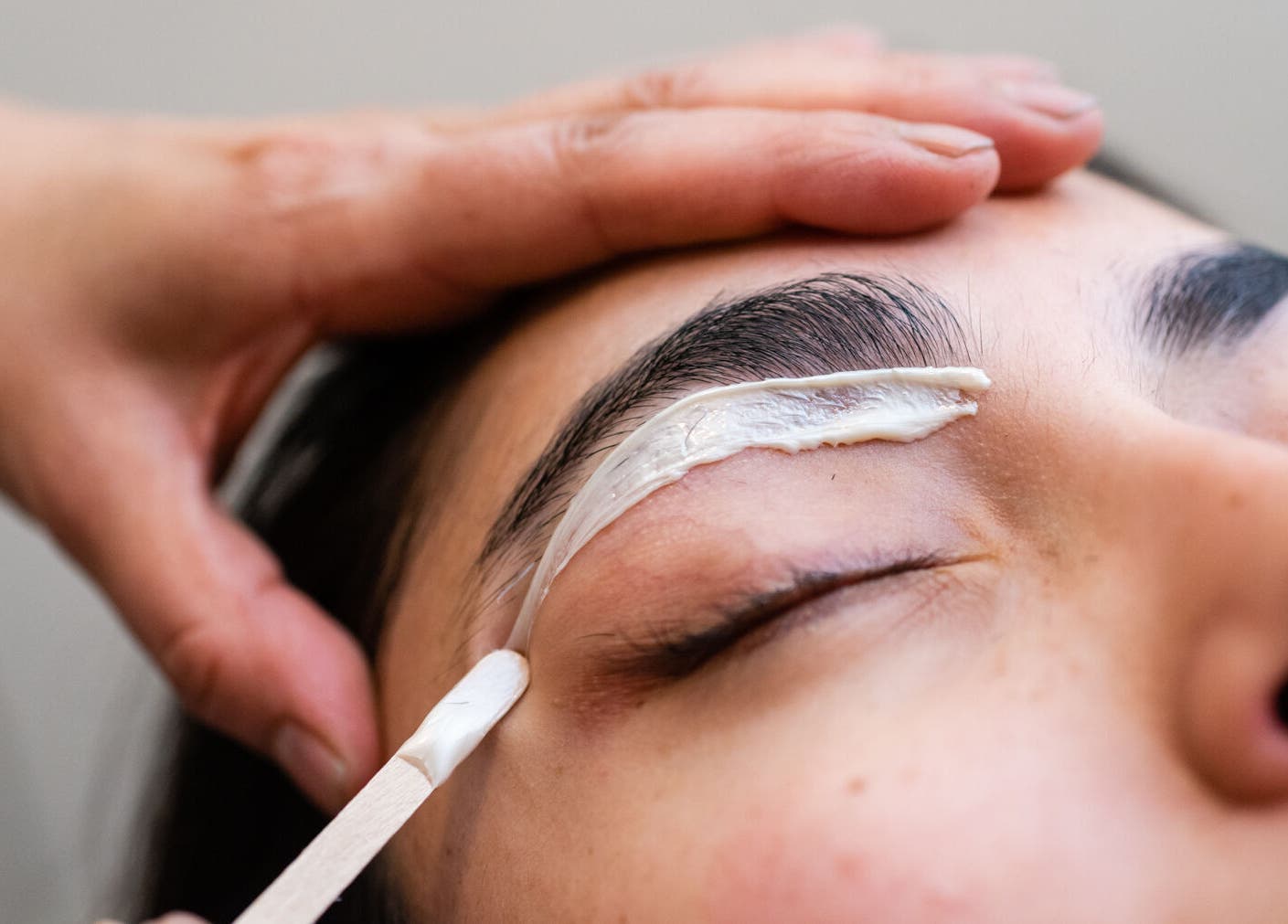 Eyebrow waxing treatment at Maribella Salon LLC, Wilmington, Delaware, US, showcasing expert precision.
