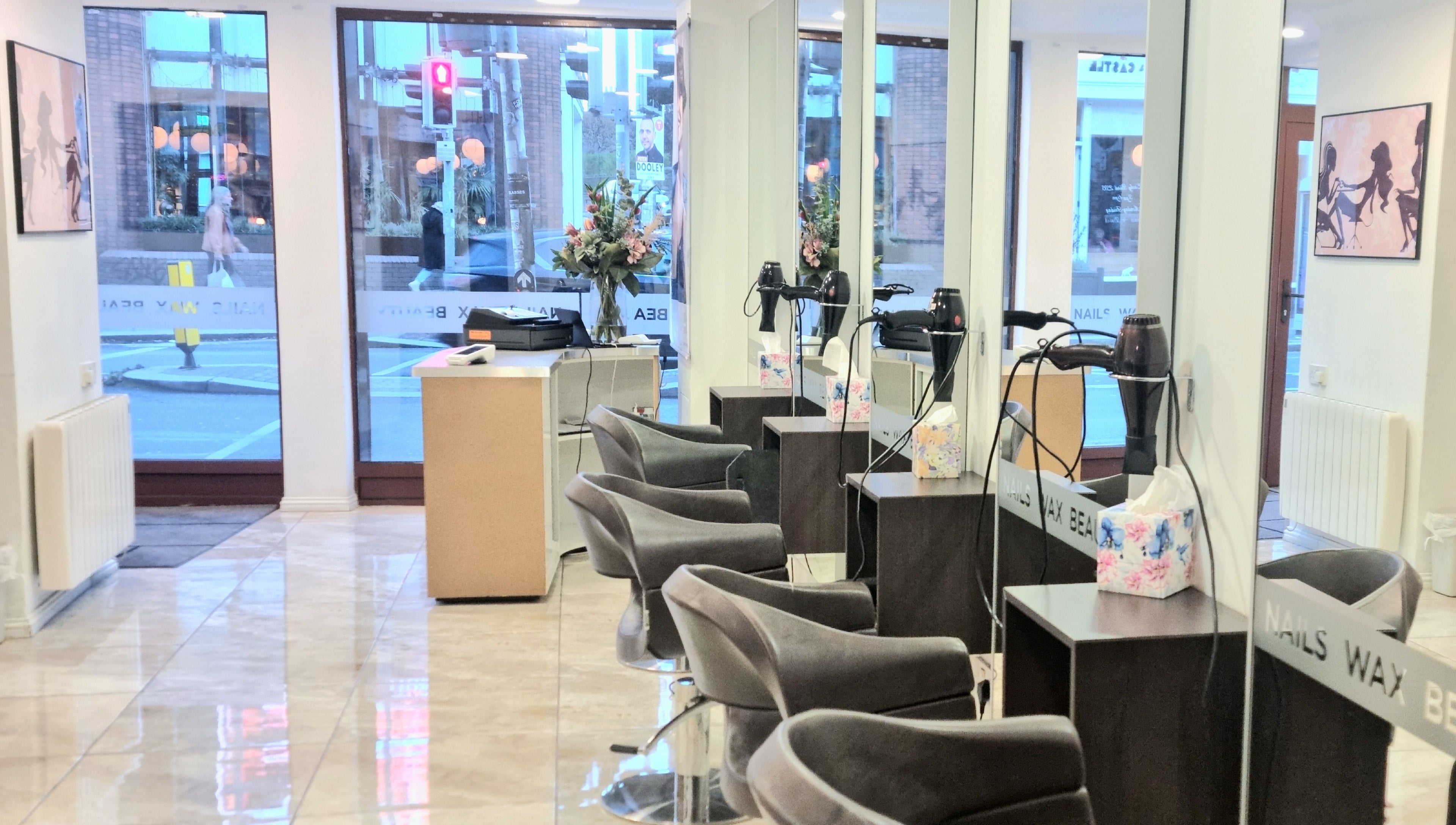 Stylish interior of Daniel and Andrew Salon in Dublin, County Dublin, IE, featuring sleek chairs and decor.