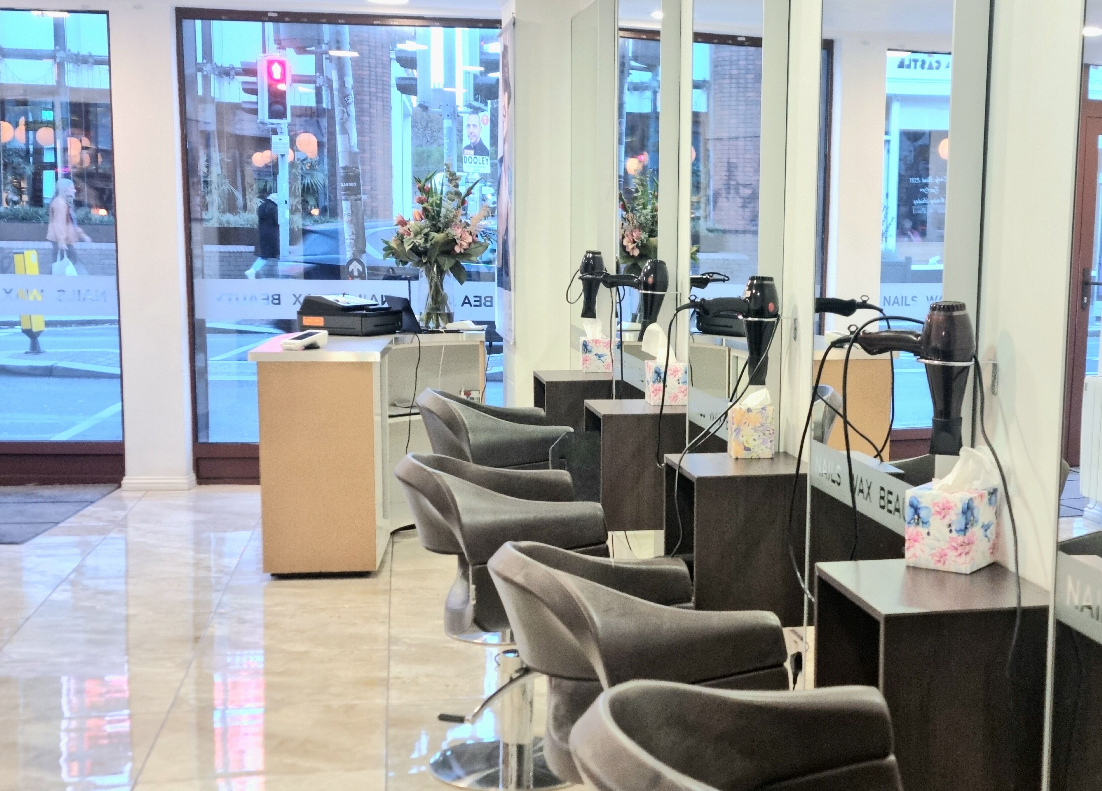 Stylish interior of Daniel and Andrew Salon in Dublin, County Dublin, IE, featuring sleek chairs and decor.