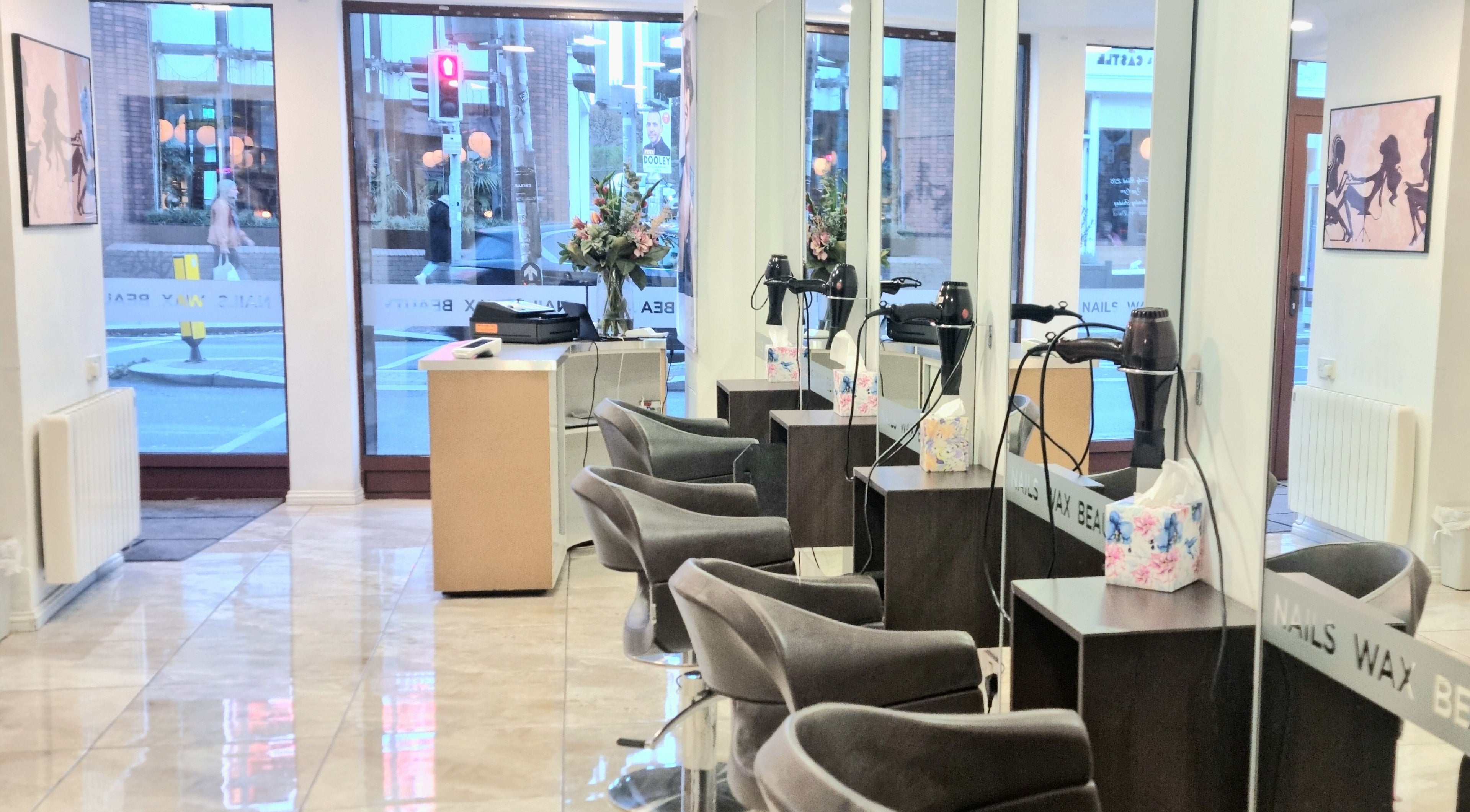 Stylish interior of Daniel and Andrew Salon in Dublin, County Dublin, IE, featuring sleek chairs and decor.