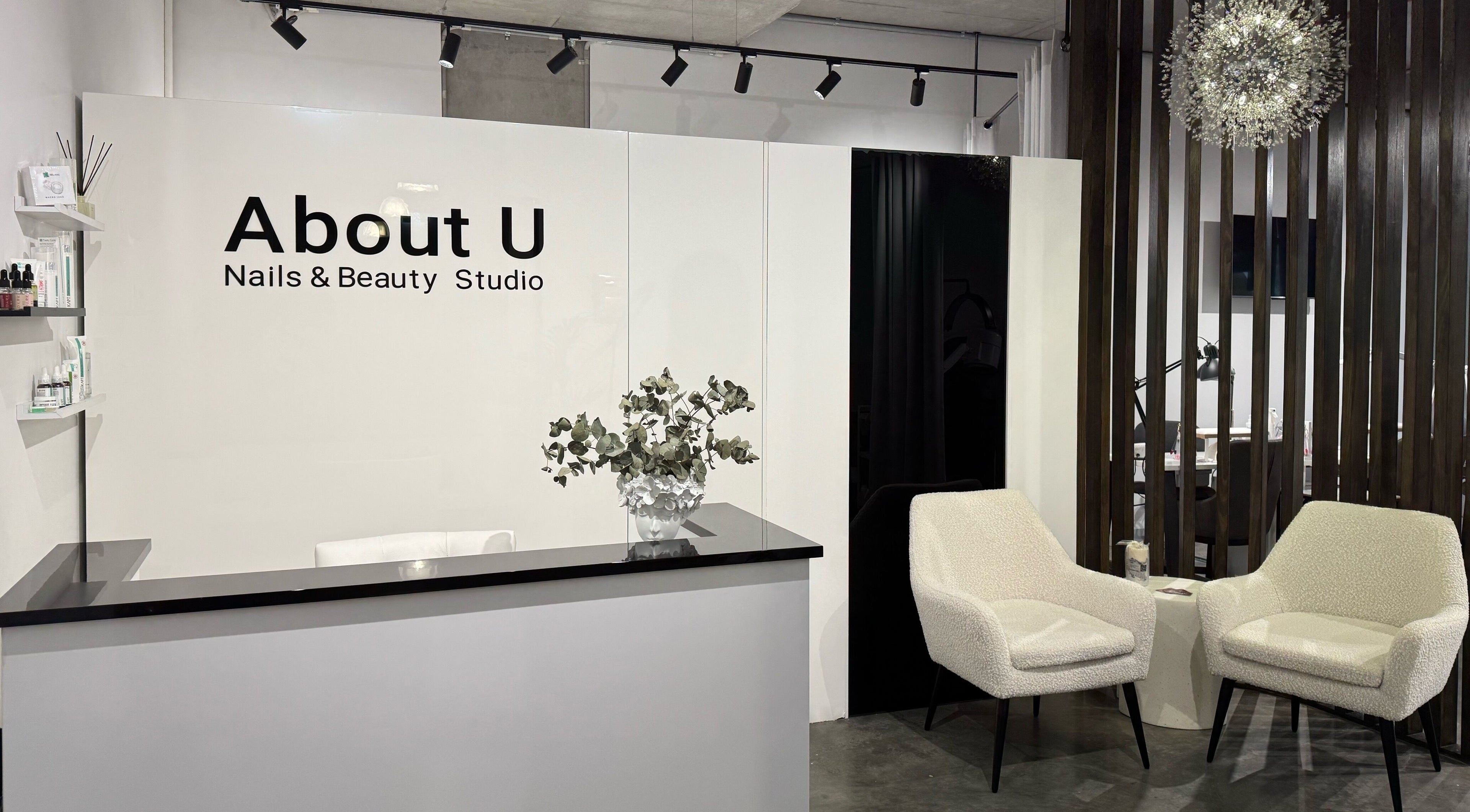 Chic reception area at About U Nails & Beauty Studio, South Melbourne, Victoria, AU, with modern decor.