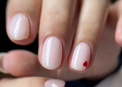 Manicured nails with a red heart at About U Nails & Beauty Studio in South Melbourne, Victoria, AU.