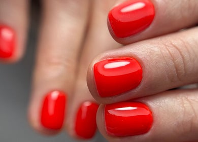 Bright red manicured nails at About U Nails & Beauty Studio in South Melbourne, Victoria, AU.