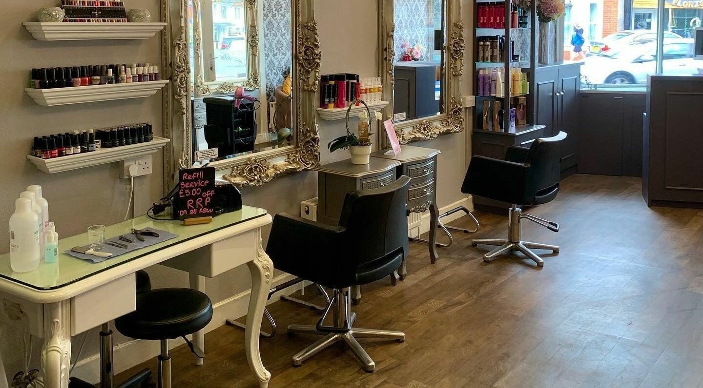 Elegant interior of Hi-lites Hair and Beauty Studio, Southsea, GB with stylish mirrors and salon chairs.