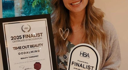 Award finalist holding certificate at Time Out Beauty, Piercing & Aesthetics, Chiddingfold, England, GB.