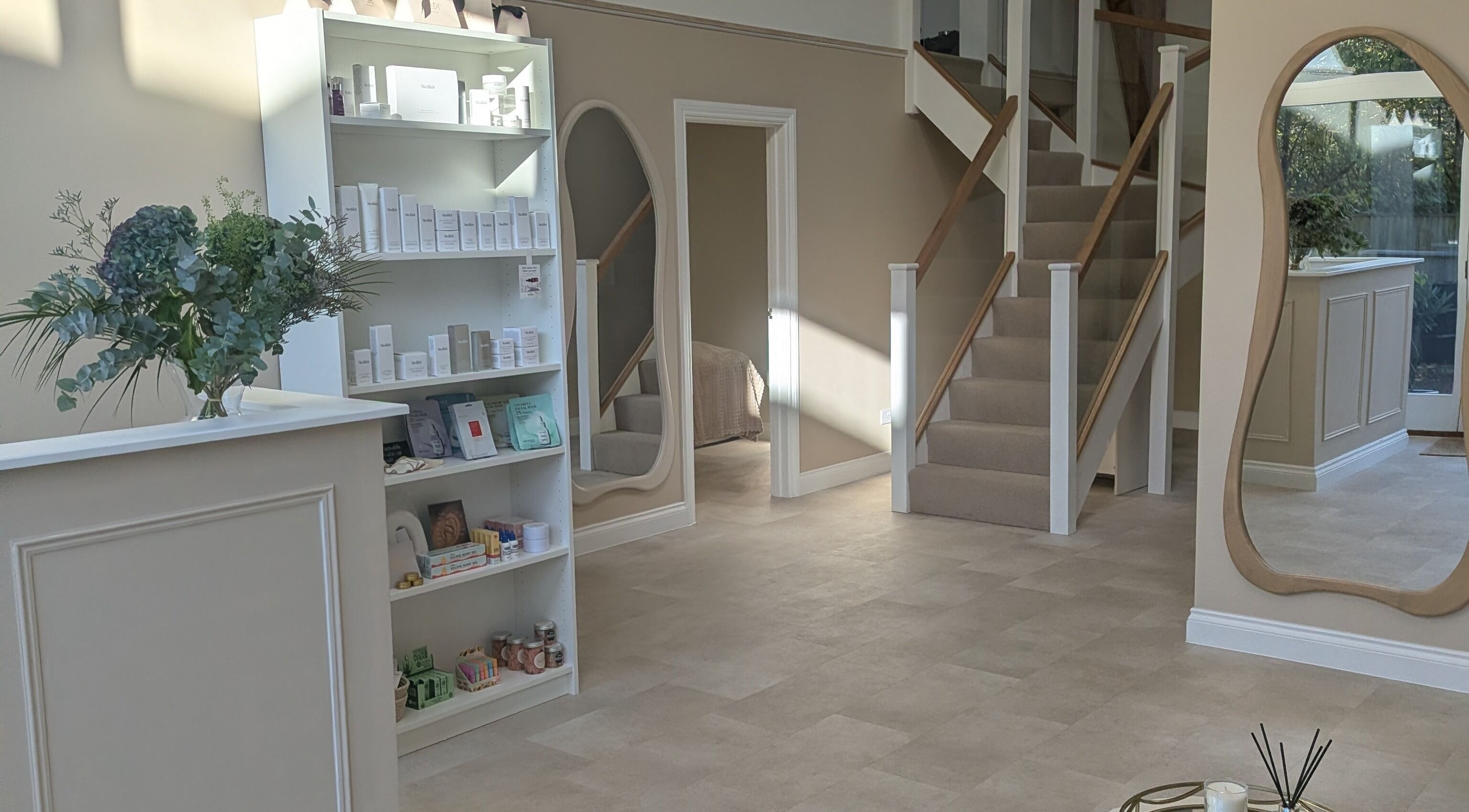 Elegant interior of Time Out Beauty, Piercing & Aesthetics in Godalming, England, GB with chic decor and product displays.