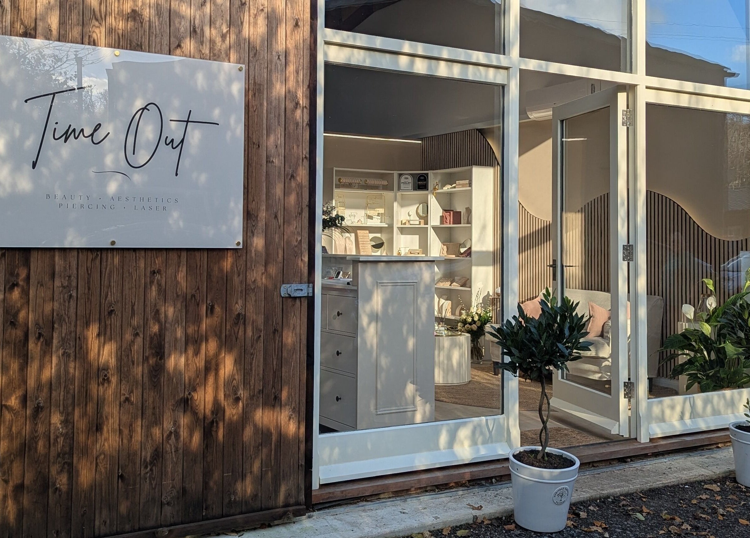 Elegant entrance of Time Out Beauty, Piercing & Aesthetics in Godalming, England, GB with welcoming decor.
