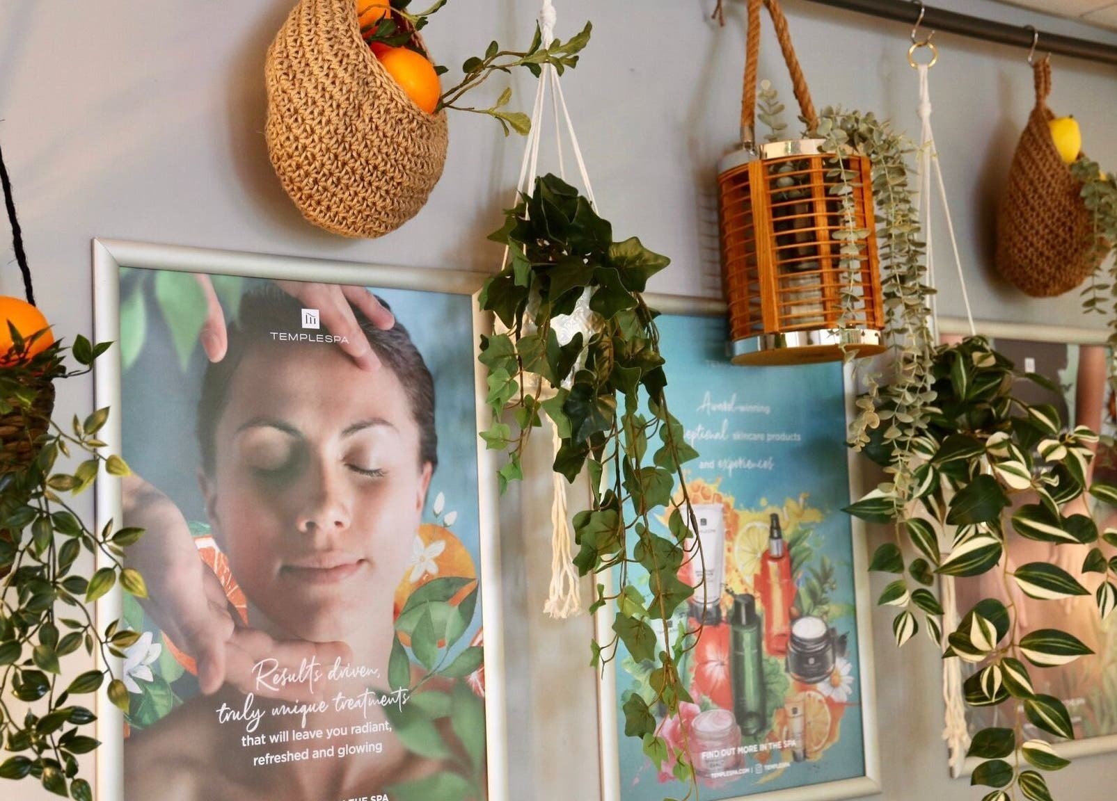 Hanging plants and posters at Clowance Spa, Clowance Estate, Camborne, England, GB.