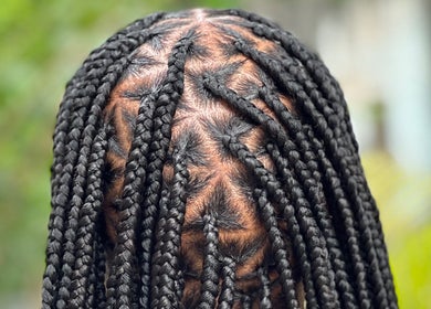Intricate braiding style at Hair Affairs 246, Bridgetown, Saint Michael, BB, showcasing expert hair artistry.
