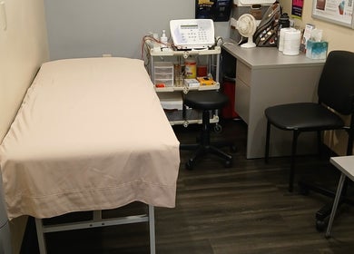 Private treatment room at Unicorn Electrolysis, Columbus, Ohio, US, featuring a comfortable bed and electrolysis equipment.