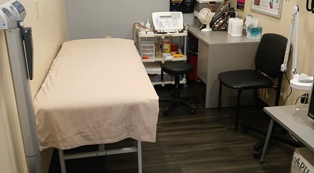 Private treatment room at Unicorn Electrolysis, Columbus, Ohio, US, featuring a comfortable bed and electrolysis equipment.