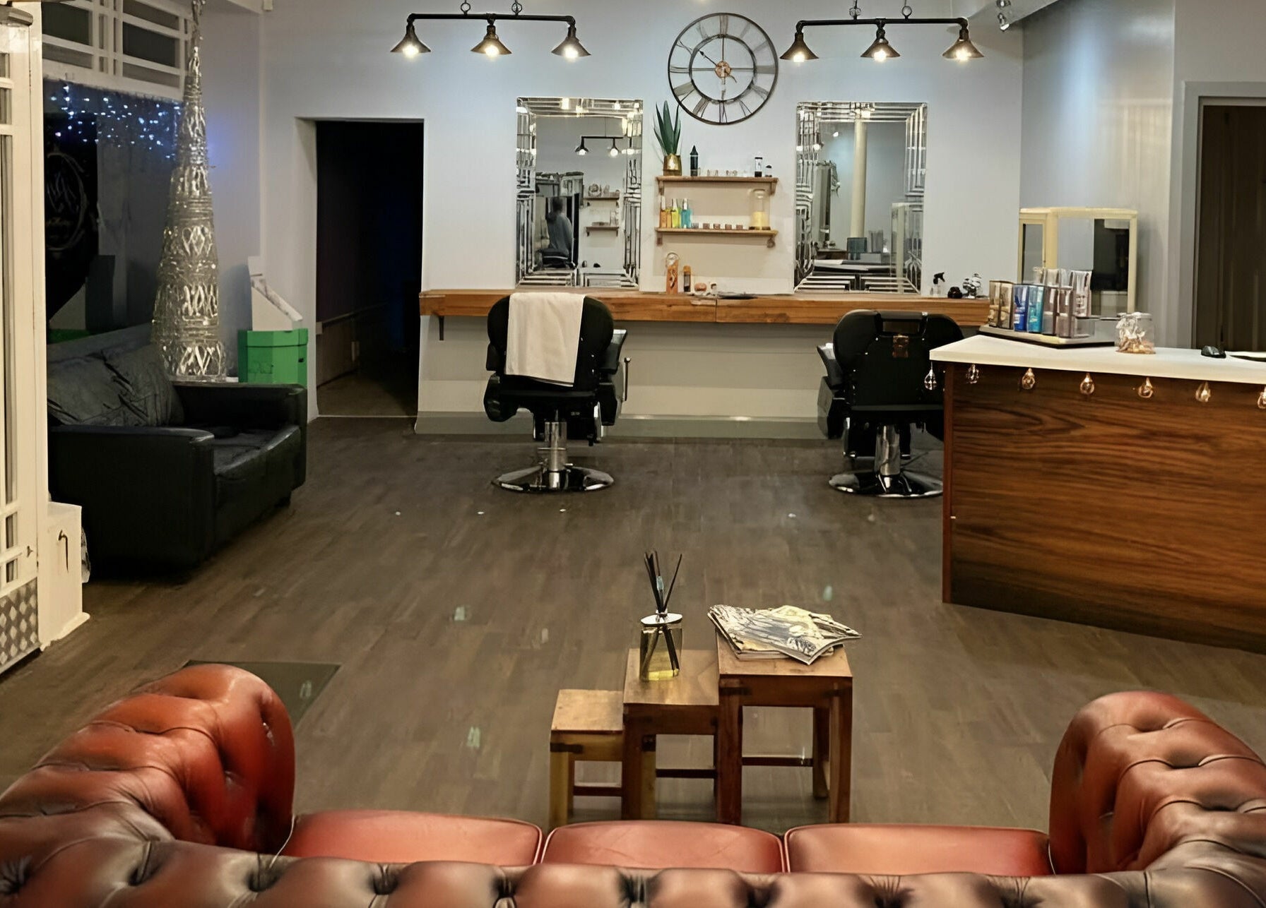 Elegant salon interior at Haigh&Co, Linthwaite, England, GB with stylish chairs and decor.