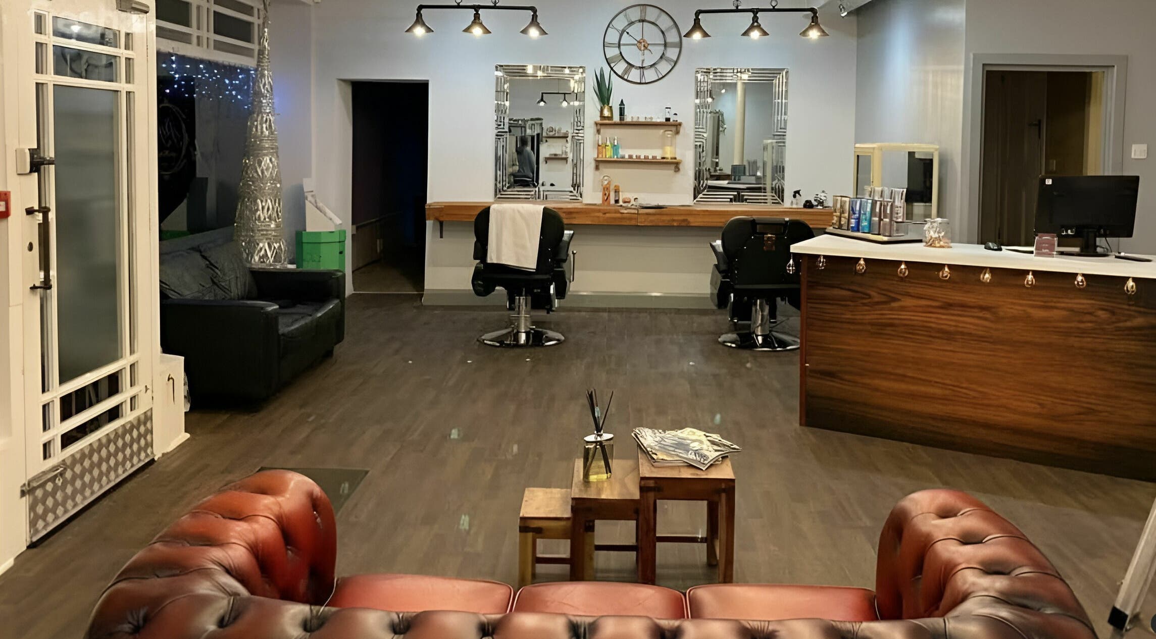 Elegant salon interior at Haigh&Co, Linthwaite, England, GB with stylish chairs and decor.