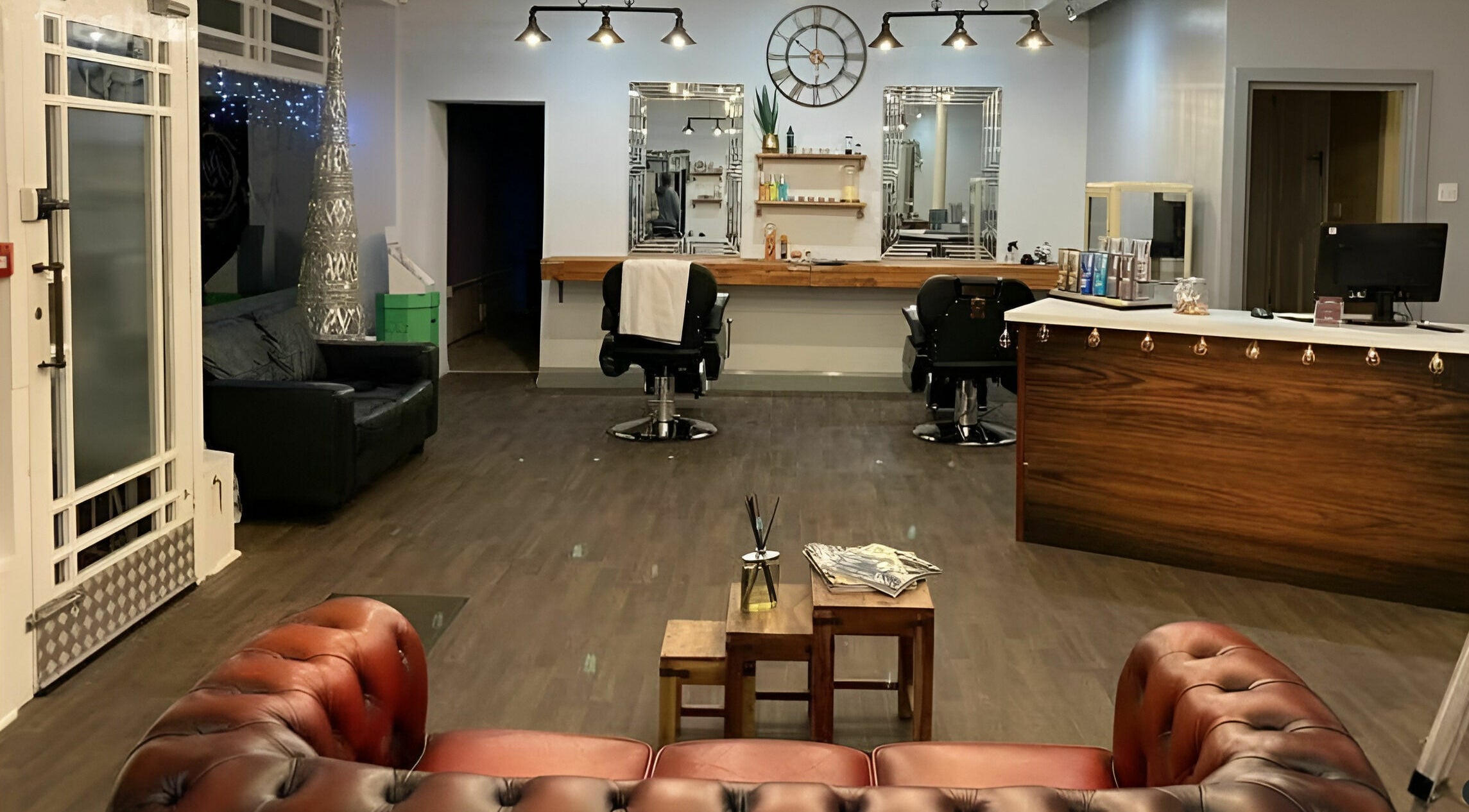 Elegant salon interior at Haigh&Co, Linthwaite, England, GB with stylish chairs and decor.