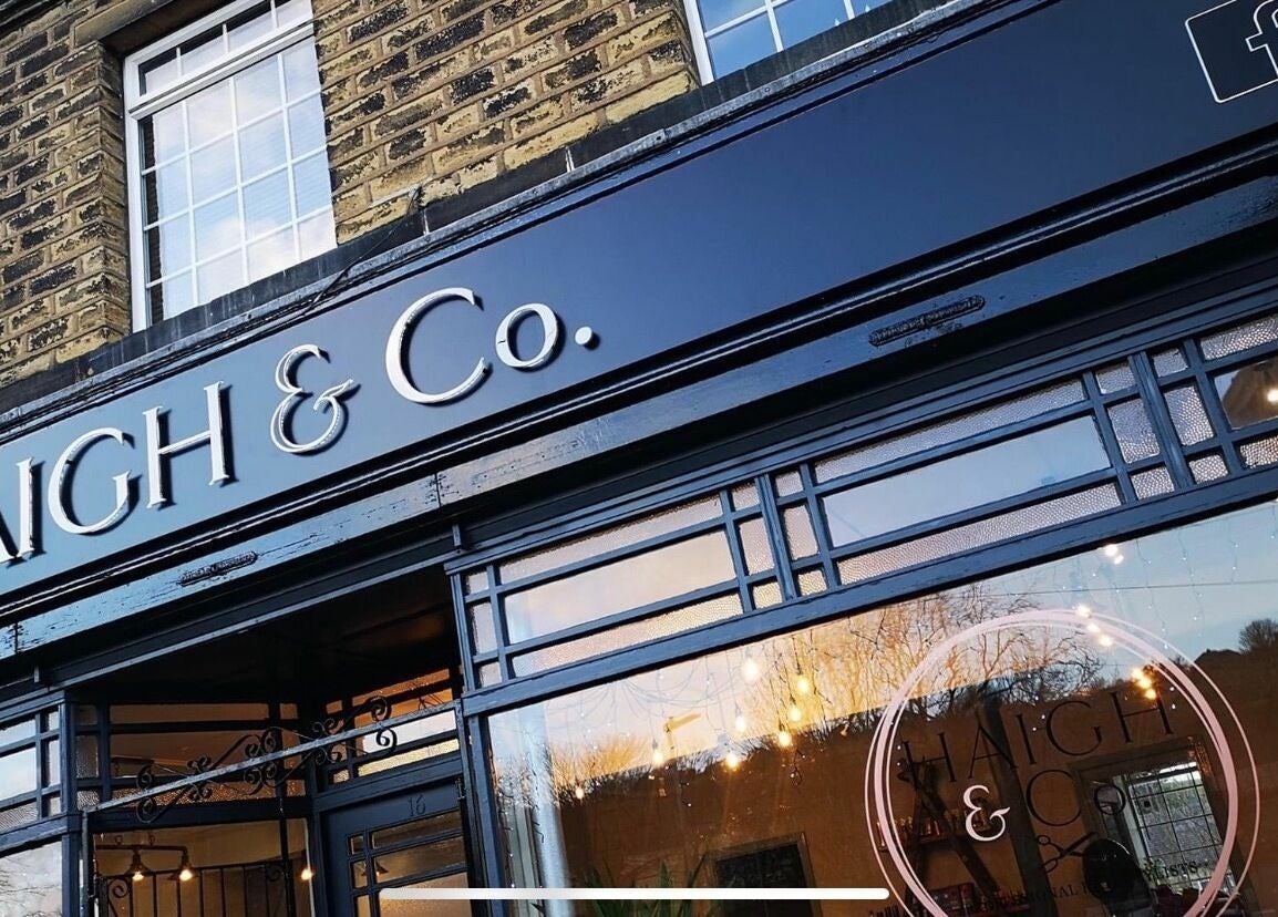 Front view of Haigh&Co in Linthwaite, England, GB showcasing elegant entrance and signage.