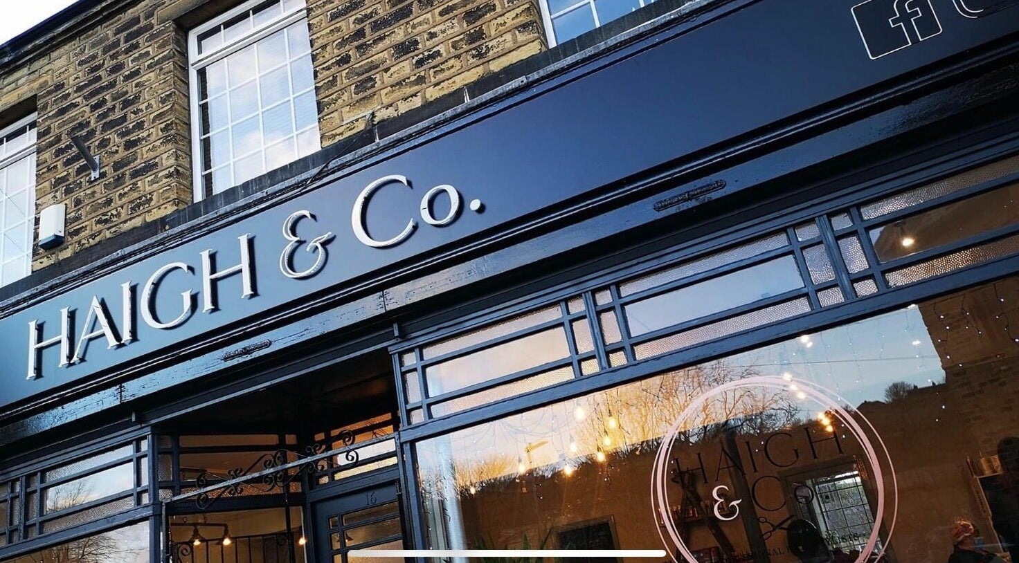 Front view of Haigh&Co in Linthwaite, England, GB showcasing elegant entrance and signage.