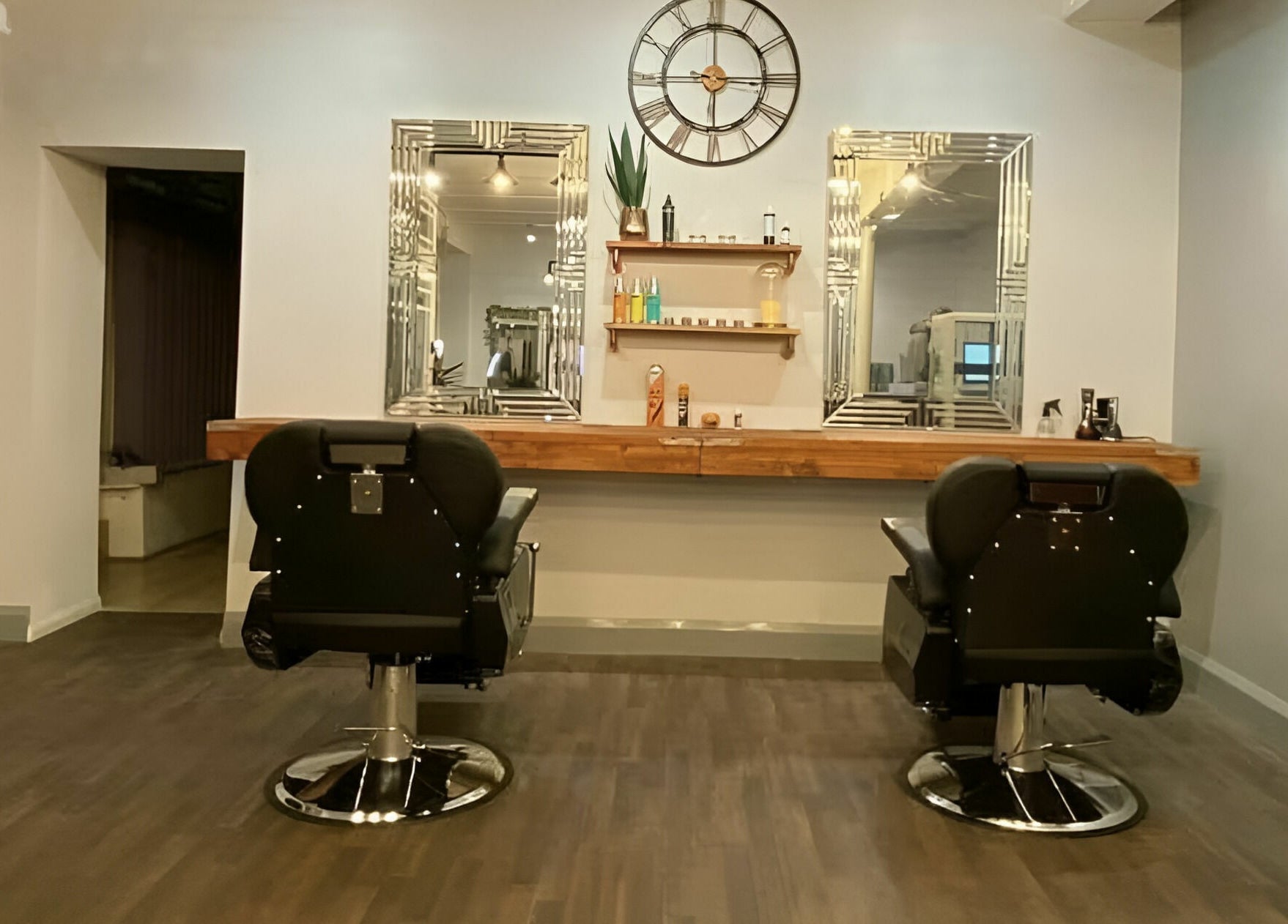 Elegant styling chairs and mirrors at Haigh&Co in Linthwaite, England, GB, showcasing chic salon design.