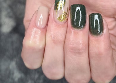 Beautiful nail design featuring green and gold art at Urban Edge Health & Beauty in Pretoria, Gauteng, ZA.