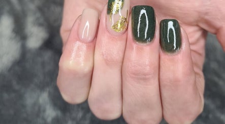 Beautiful nail design featuring green and gold art at Urban Edge Health & Beauty in Pretoria, Gauteng, ZA.