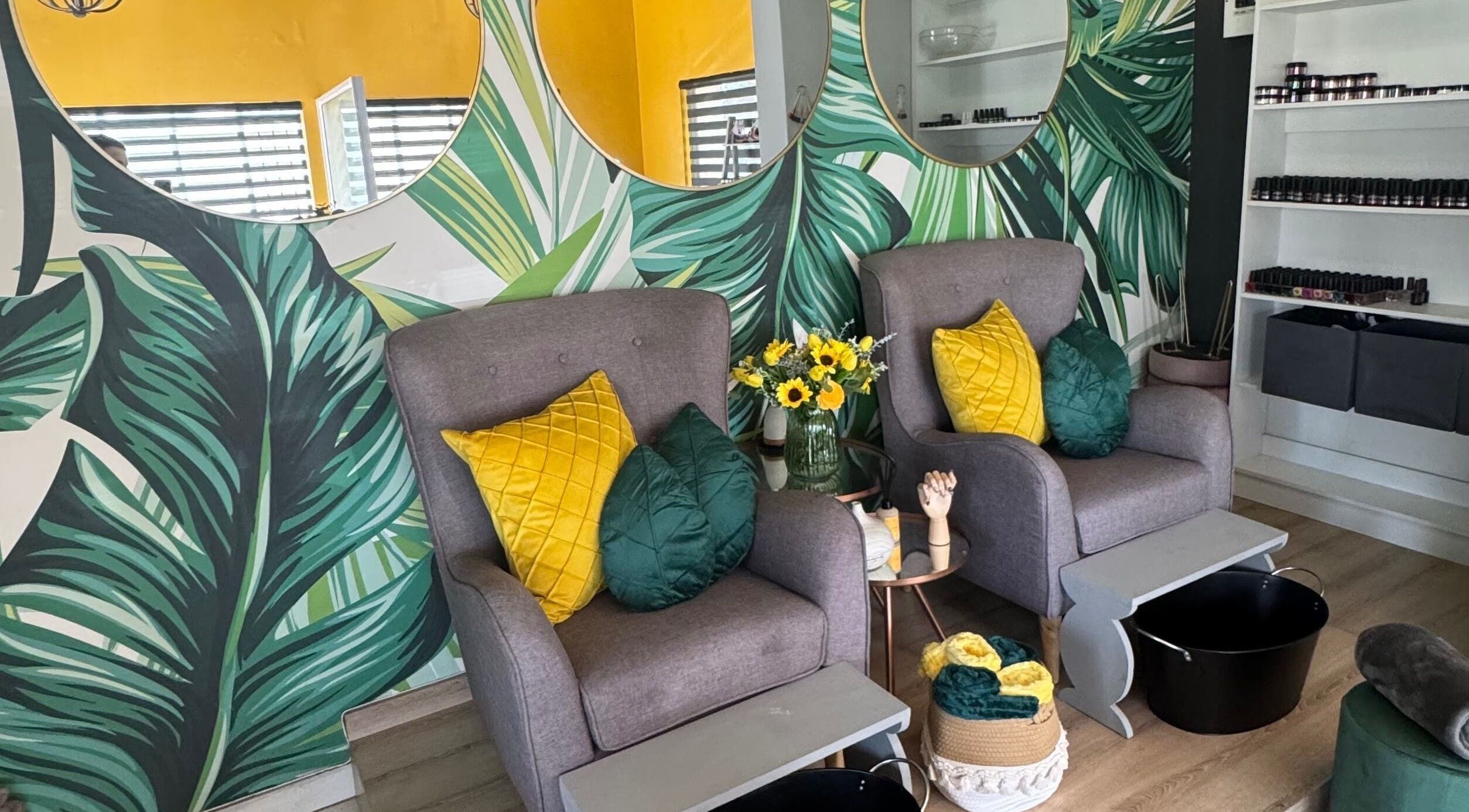 Luxurious seating area at Urban Edge Health & Beauty in Pretoria, Gauteng, ZA with vibrant tropical decor.