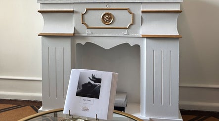 Elegant mantelpiece at Flávio Vilhais SkinLab, Lisboa, Lisboa, PT with a face care brochure displayed.