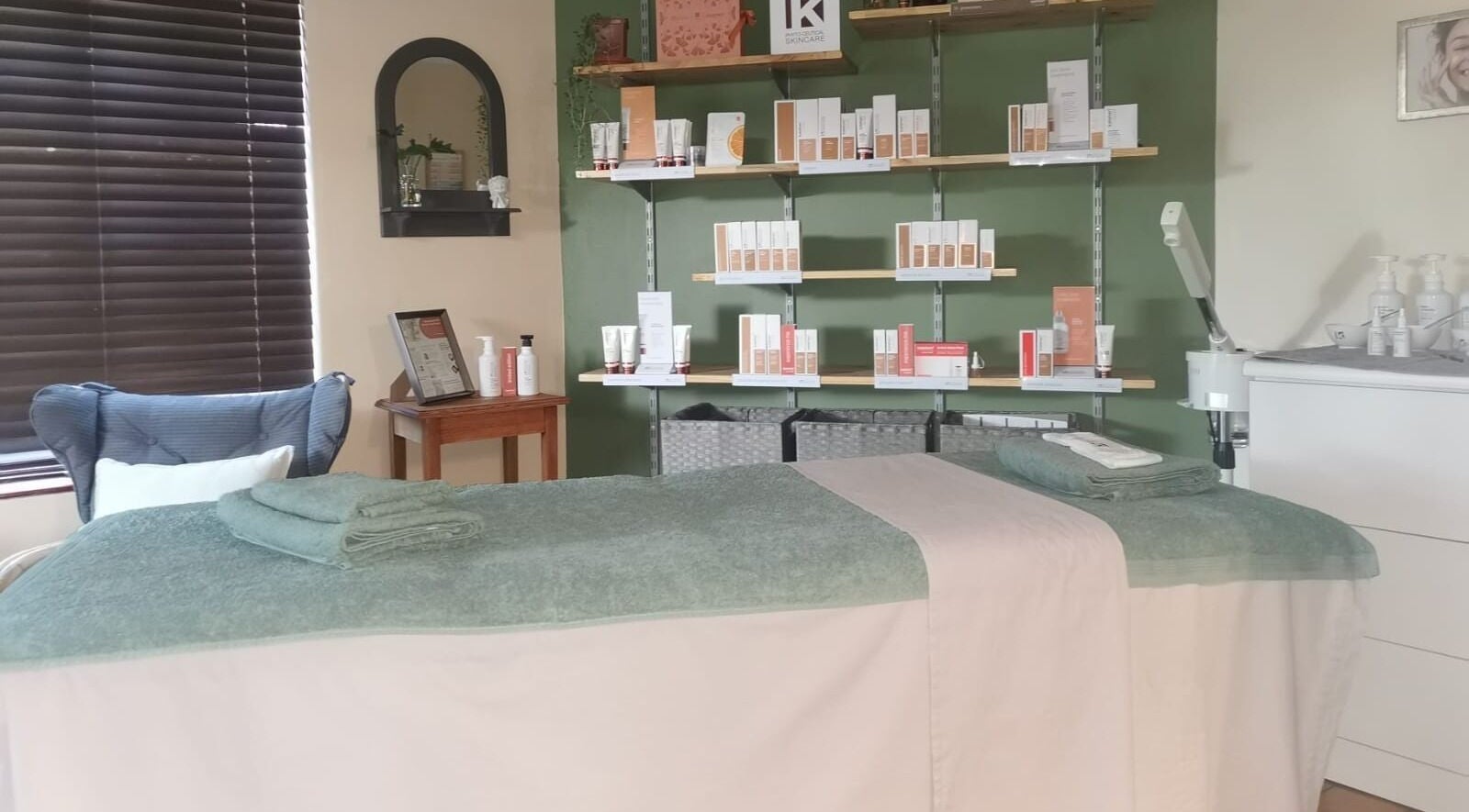 Relaxing spa room at Be You Holistic Wellness, Cape Town, Western Cape, ZA with treatment bed and product shelves.