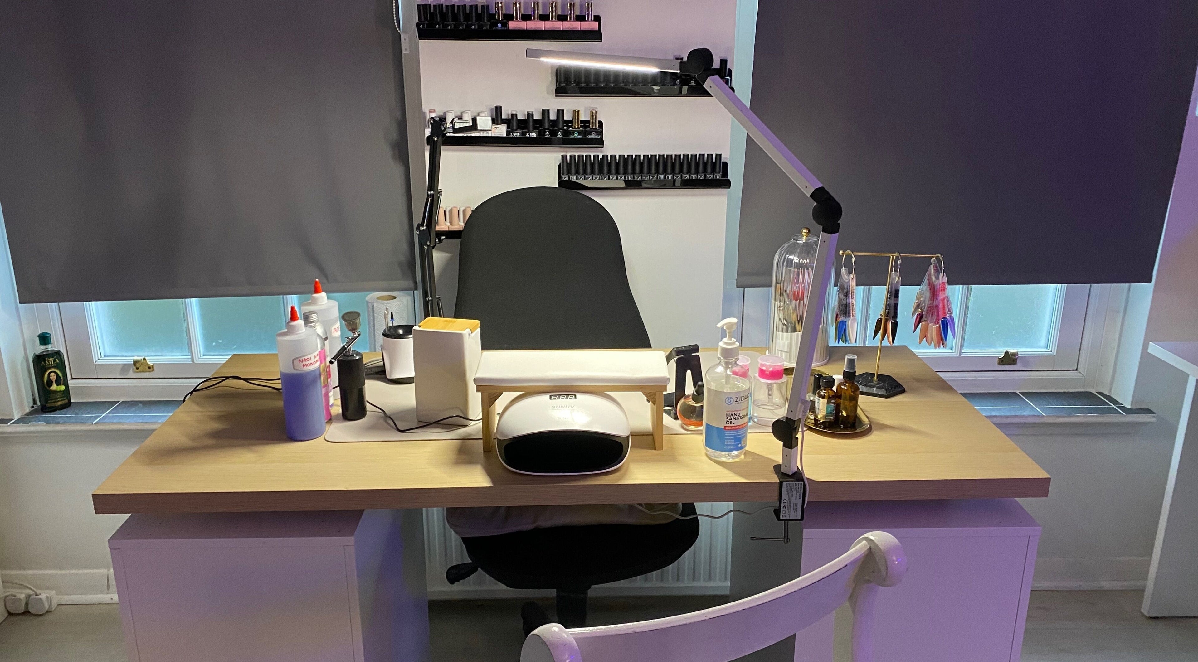 Manicure station at Your Aesthetic, London, England, GB with tools and polish on display.