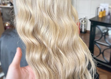 Blonde wavy hair styled at Joseph Rotchford Hair, Harrogate, England, GB, showcasing salon expertise.