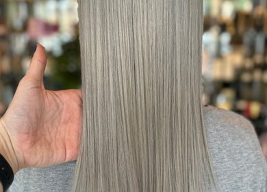 Sleek silver hair styling at Joseph Rotchford Hair, Harrogate, England, GB salon for a polished look.
