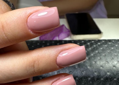 Elegant manicured nails at Nailina Ny, Scarsdale, New York, US showcasing a perfect pink polish.