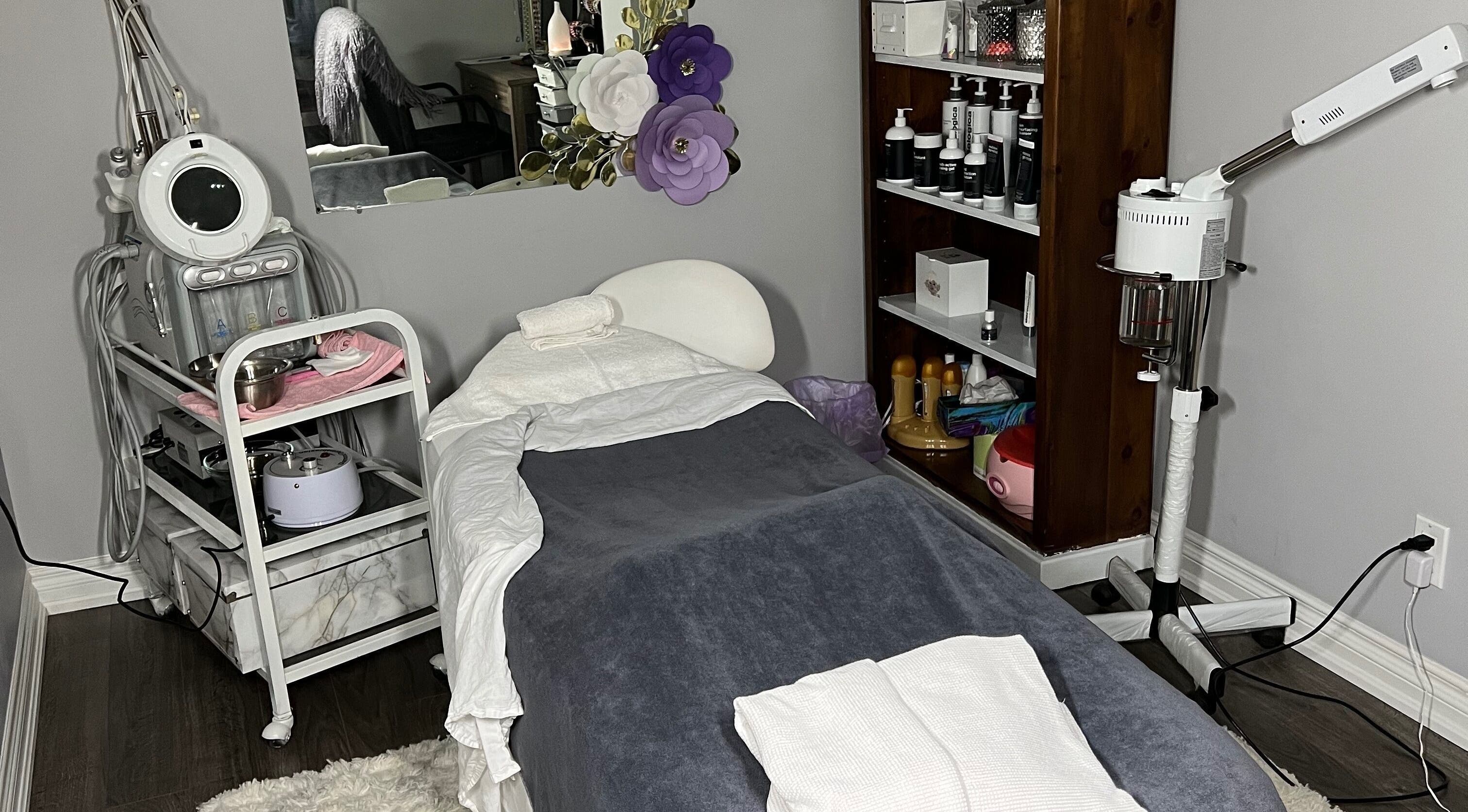 Relaxing spa room setup at Upper Glow Aesthetics, Ajax, Ontario, CA with treatment bed and equipment.