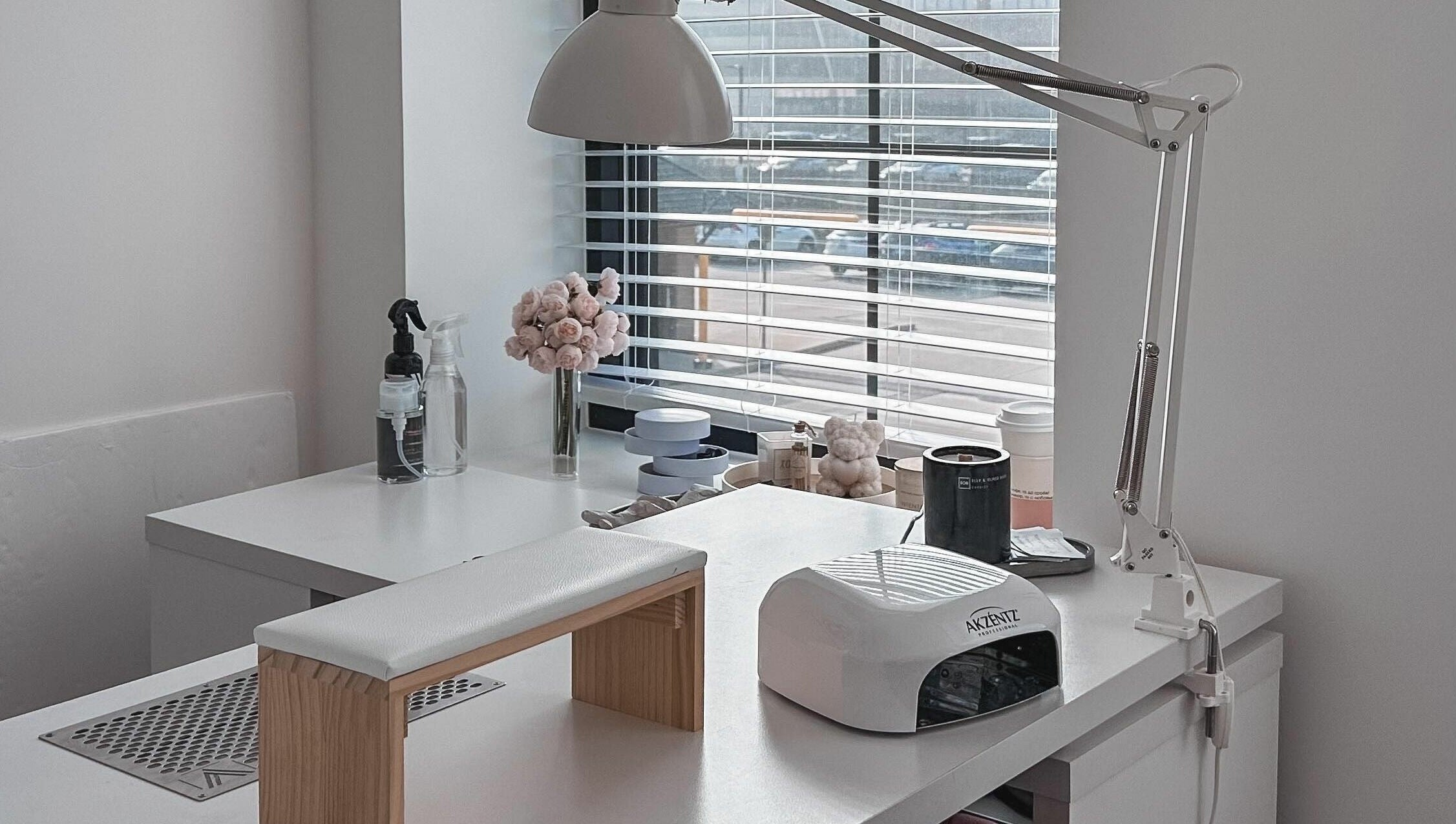 Bright nail station at Studio Boka, Highland Park, Illinois, US, with modern decor and manicure tools.