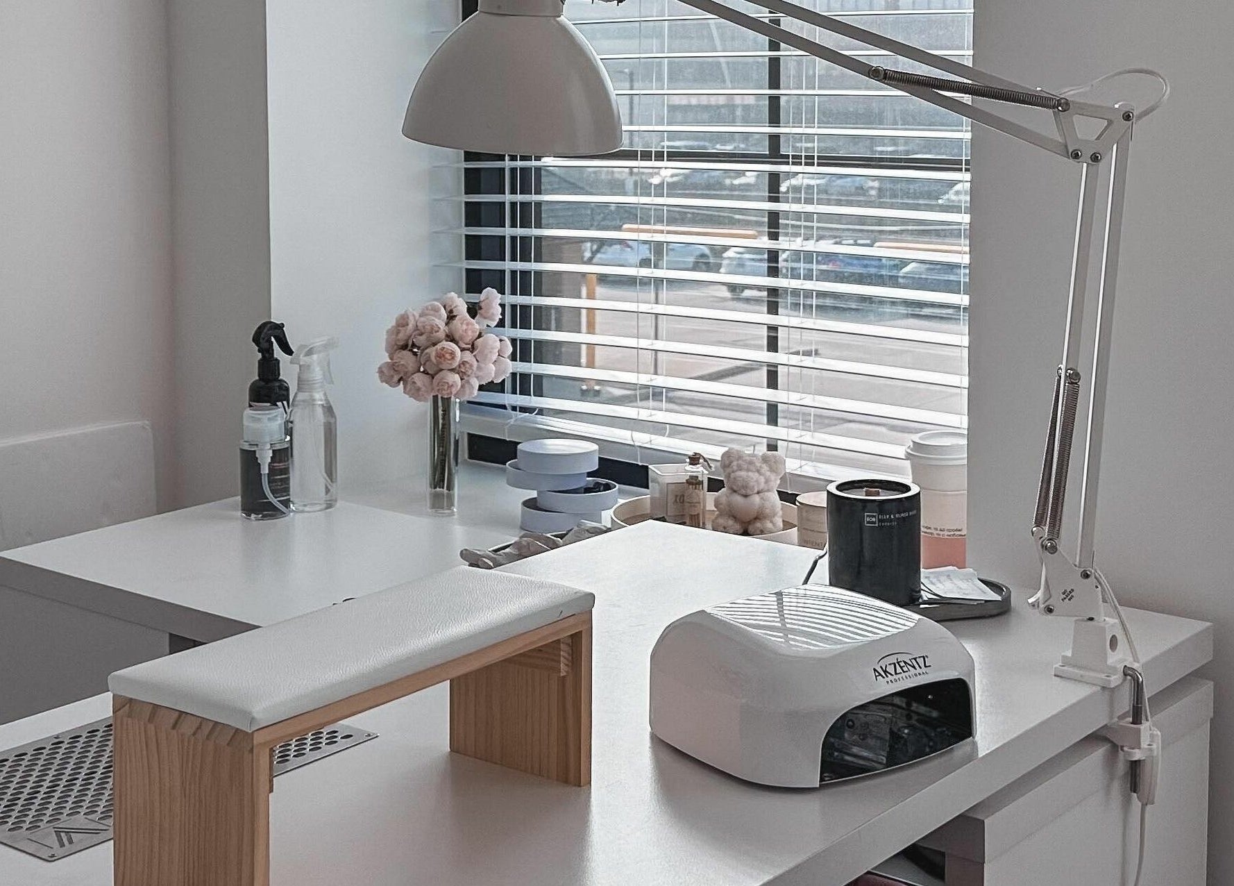 Bright nail station at Studio Boka, Highland Park, Illinois, US, with modern decor and manicure tools.