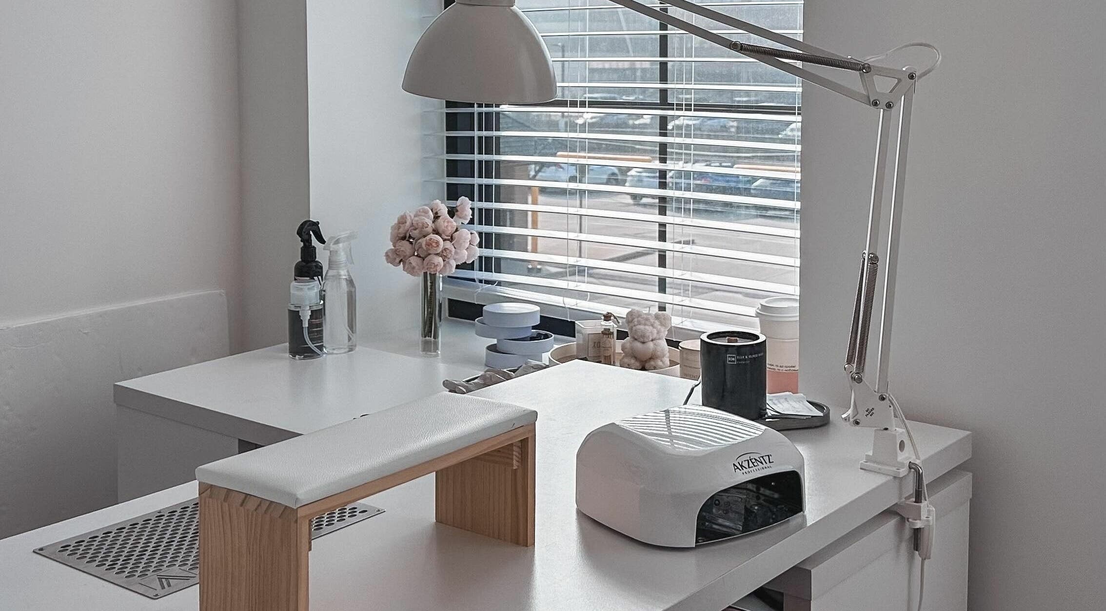 Bright nail station at Studio Boka, Highland Park, Illinois, US, with modern decor and manicure tools.