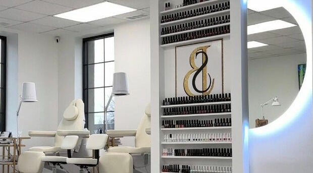 Elegant nail salon at Studio Boka in Highland Park, Illinois, US showcasing sleek design and product display.
