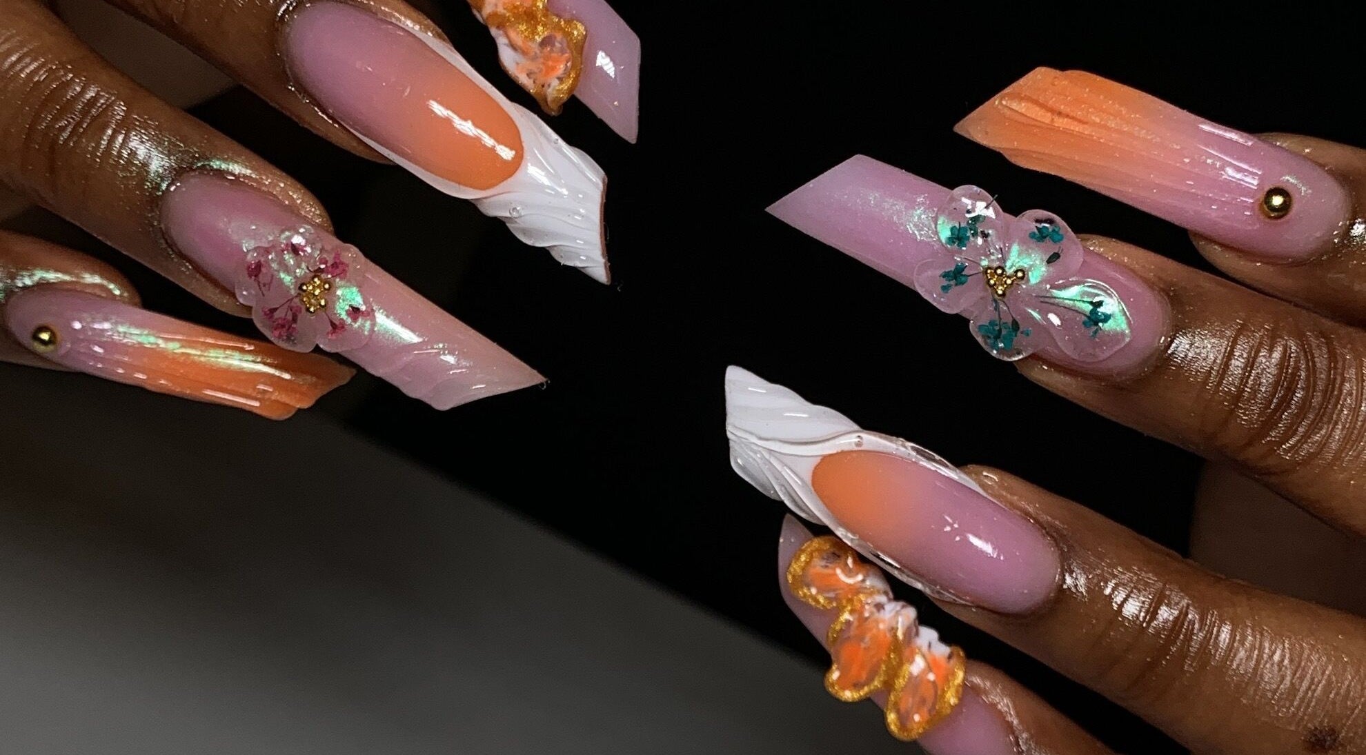 Elegant floral nail art at Fingers to Toes, Lagos, Lagos, NG, showcasing detailed 3D flower designs.