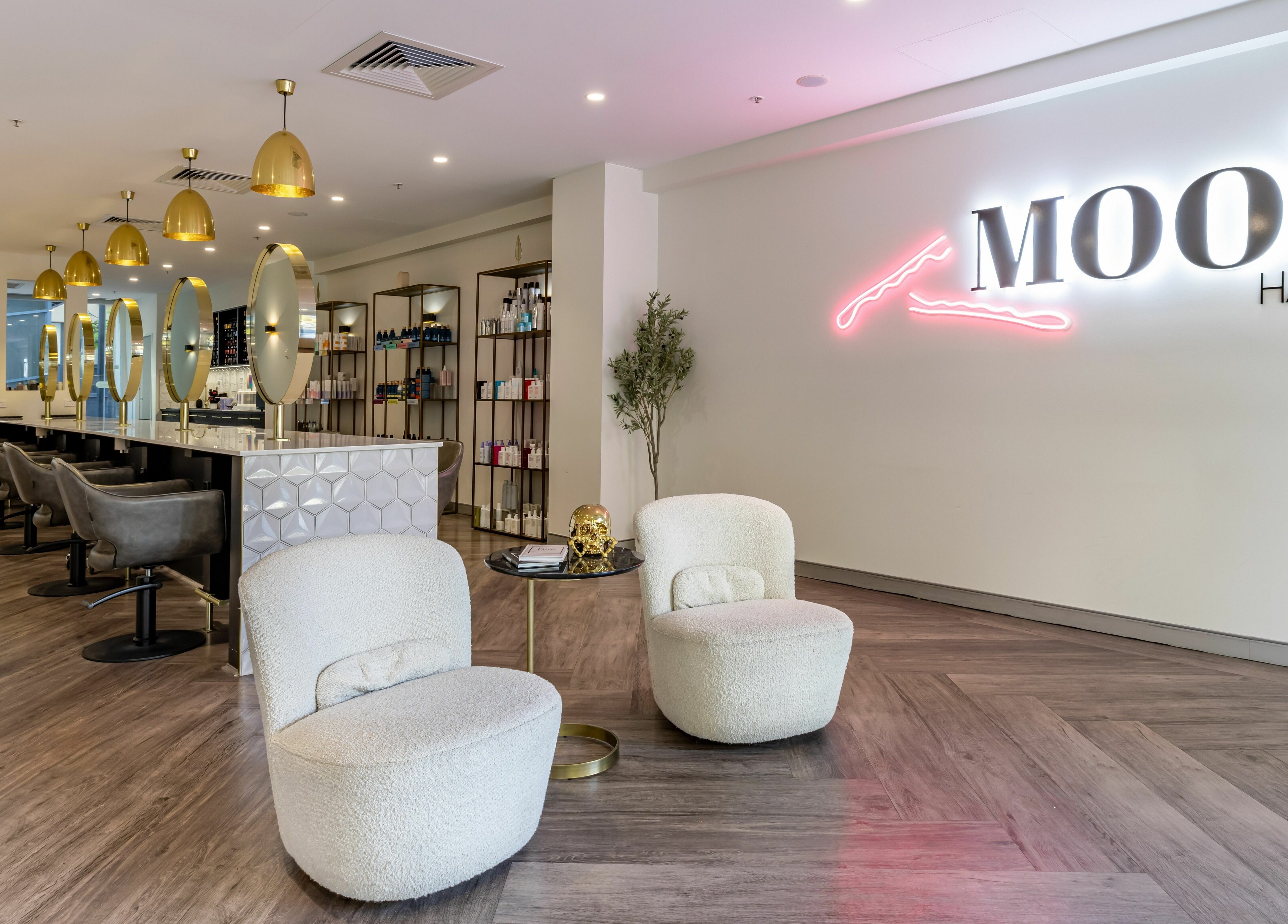 Chic interior of Mooi Hair CBR in Canberra, AU, showcasing modern seating and stylish decor.