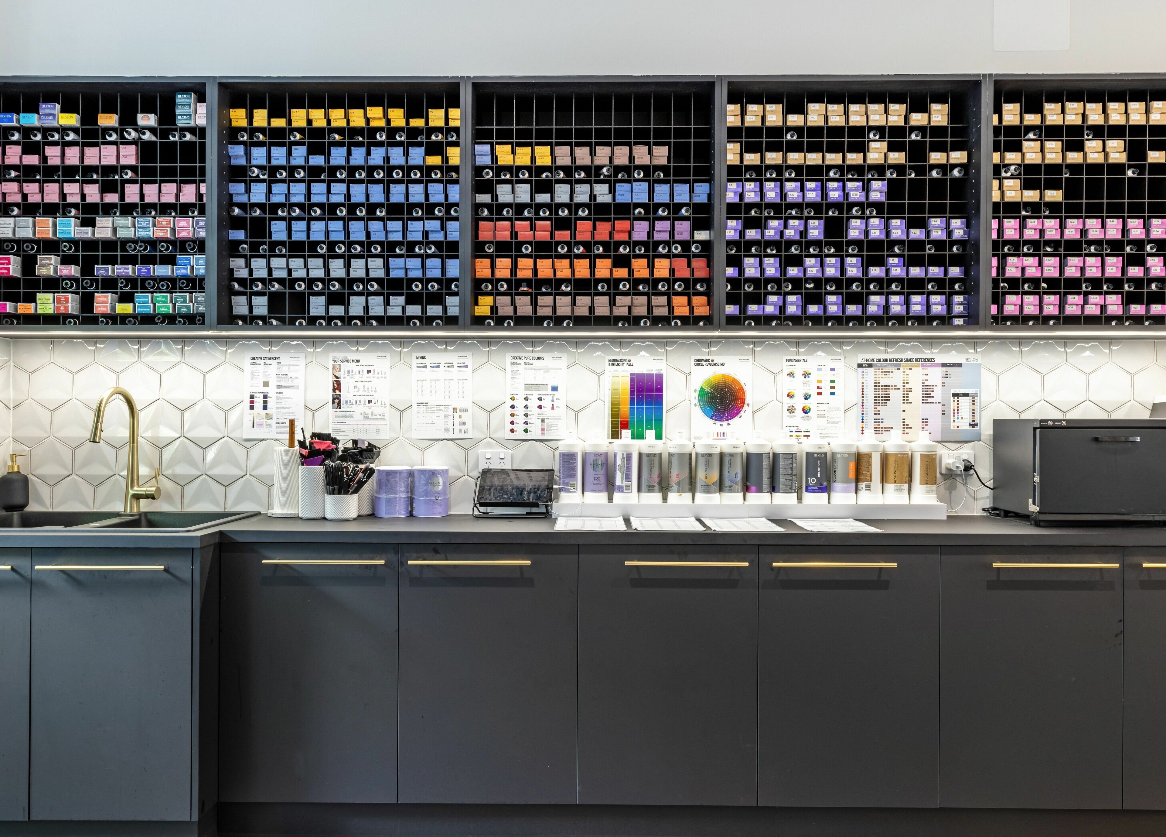 Mooi Hair CBR hair color station in Canberra, Australian Capital Territory, AU with organized dye shelves.