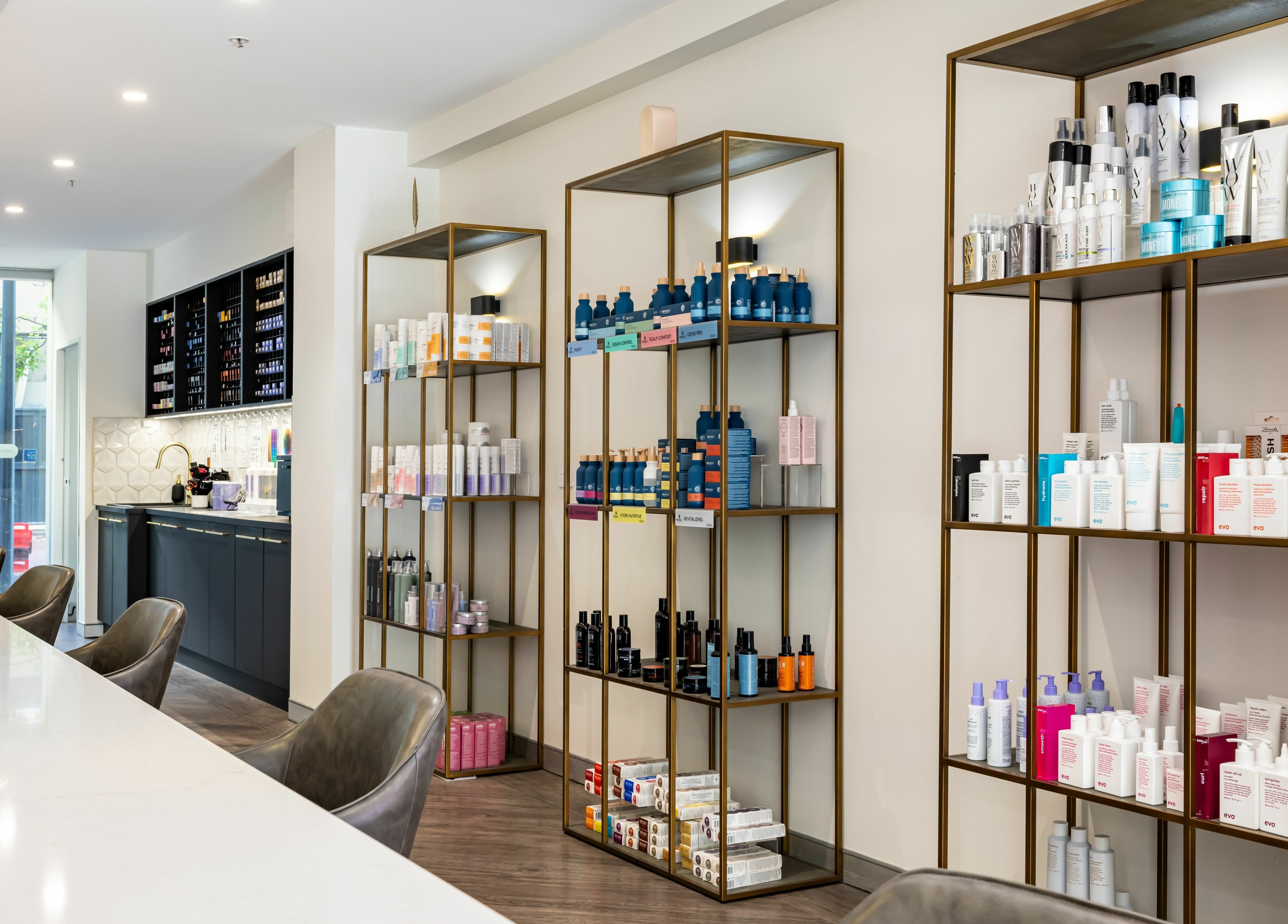 Stylish shelves with beauty products at Mooi Hair CBR, Canberra, Australian Capital Territory, AU.