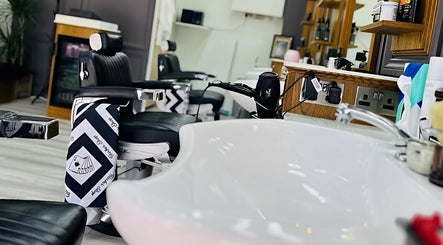 Sleek interior of Vauxhall Barbers in London, England, GB featuring modern barber chairs and amenities.