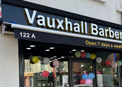 Exterior of Vauxhall Barbers decorated with balloons in London, England, GB.