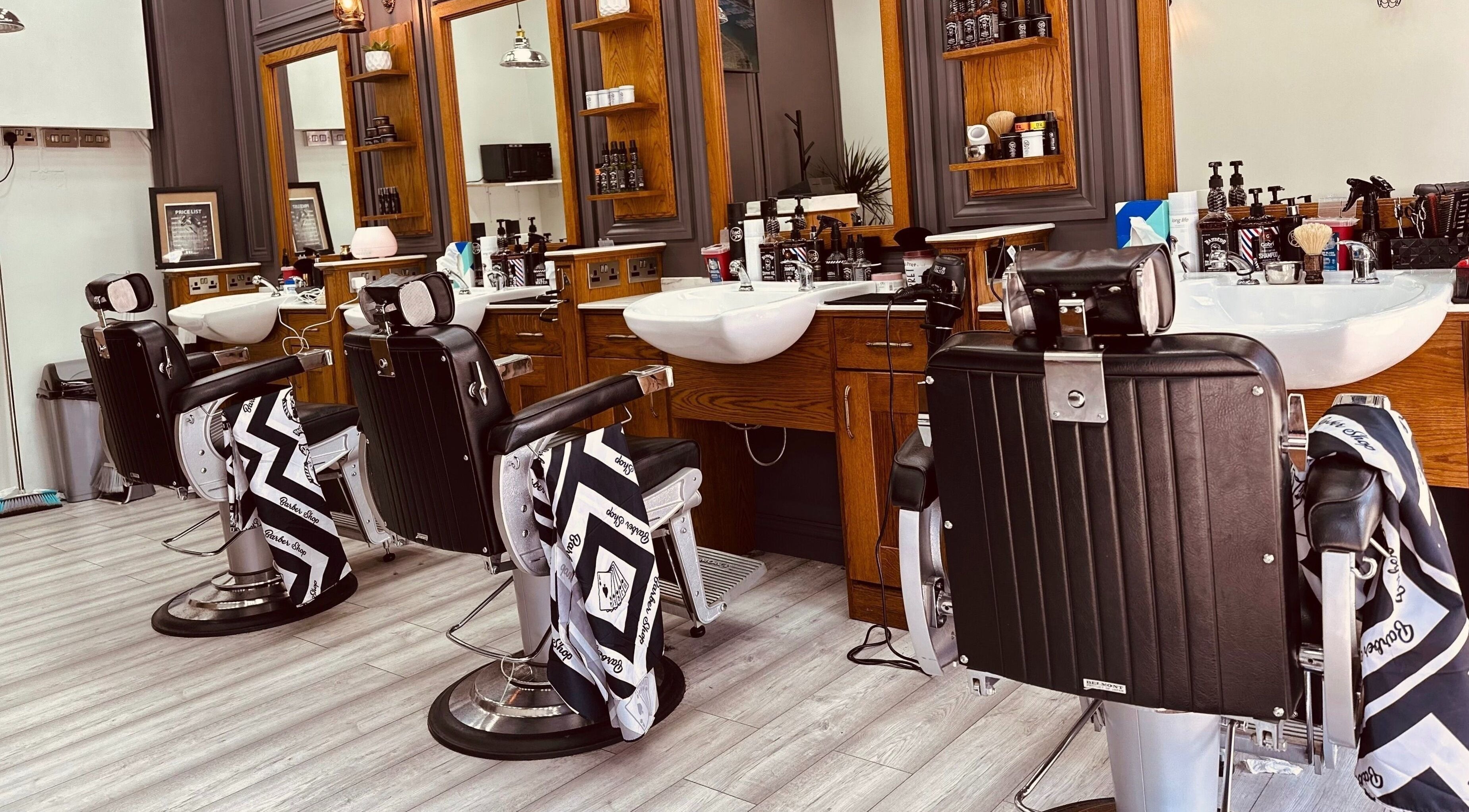 Modern barber chairs at Vauxhall Barbers, London, England, GB showcasing a stylish interior.