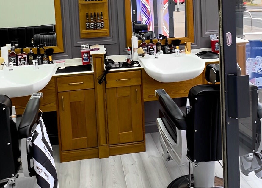 Inside Vauxhall Barbers in London, England, GB; showcases modern barber chairs and grooming stations.