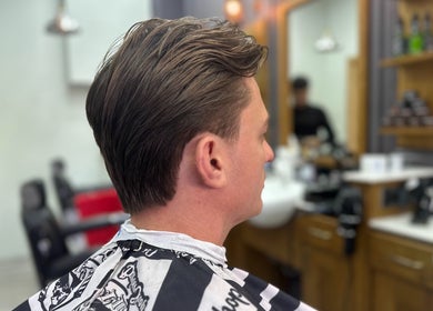 Man with a stylish haircut at Vauxhall Barbers, London, England, GB.